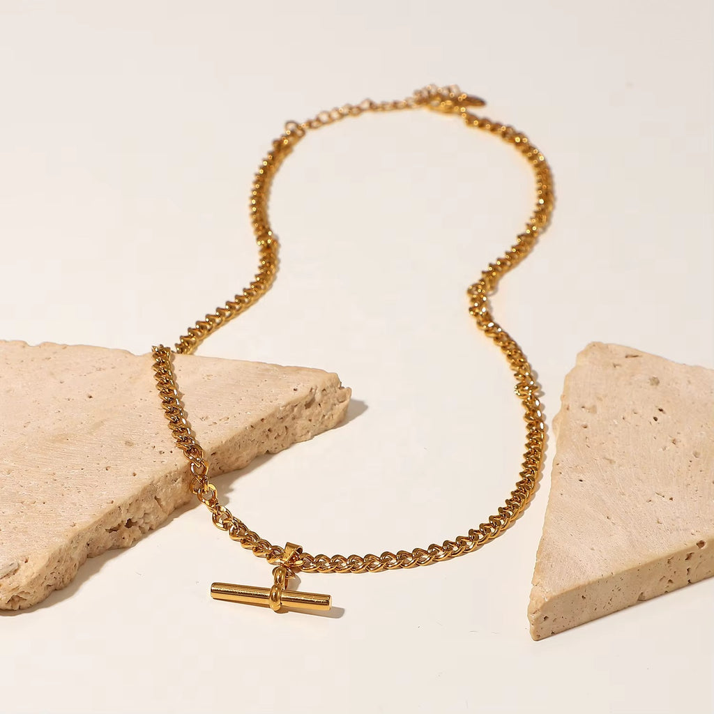 T-Bar Necklace styled on travertine